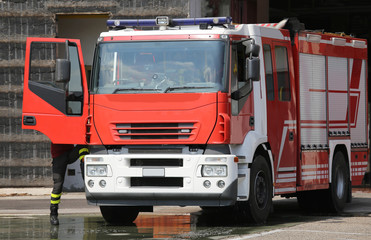 fire engine truck during an exercise in fire brigade station