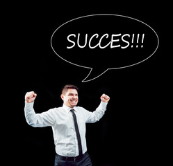 Businessman on a background of black wall.