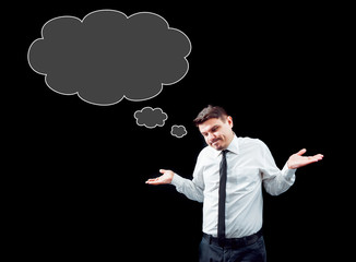 Businessman on a background of black wall.