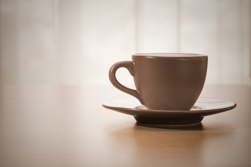 Coffee cup on wood table,vintage style