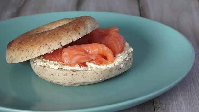 New York Salmon bagel served on a plate. Food background and texture. copy space
