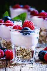 Sweet berry dessert with oatmeal, yogurt, blueberries and raspbe