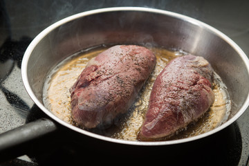 Duck fillet on grille pan. Poultry meat prepared on a grill. Fresh, delicious, spicy dish on a kitchen with copy space closeup and copy space.
