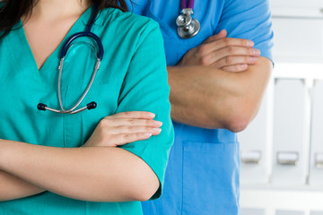 Two doctors standing with their arms crossed on chest