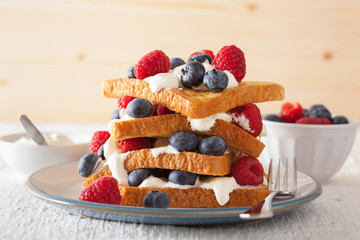 french toasts with creme fraiche and berries for breakfast