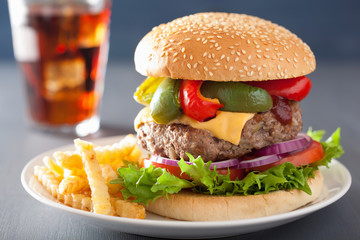 homemade cheese burger with peppers tomato onion