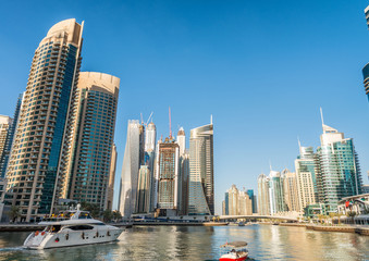 Fototapeta na wymiar Buildings over the water in Dubai Marina, United Arab Emirates
