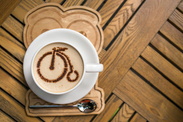 Cup of coffee with bicycle picture