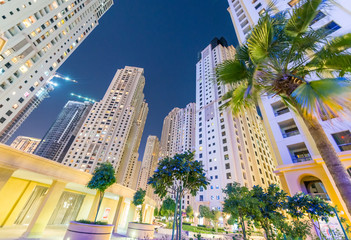 Fototapeta na wymiar Dubai Marina skyline at night from street level, United Emirates