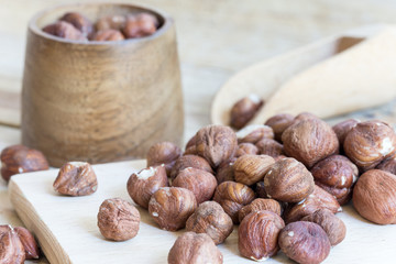 Pile of hazelnuts on the rustic table boards