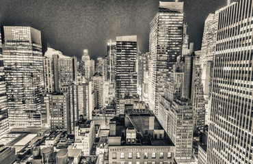 Manhattan skyscrapers at night as seen from New York rooftop