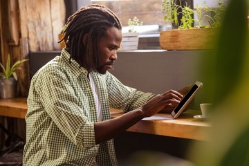Man using a tablet sitting