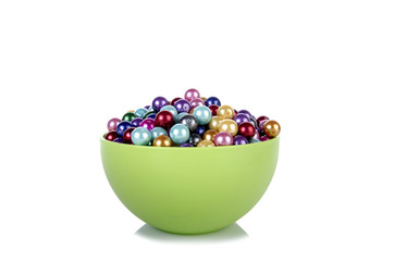 Pearls in the bowl isolated on white background