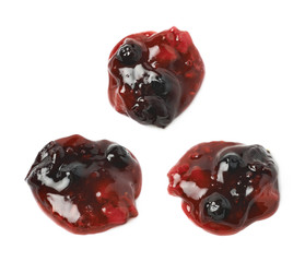 Spill of wild berries jam isolated