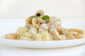 squid rings potato sauce white plate