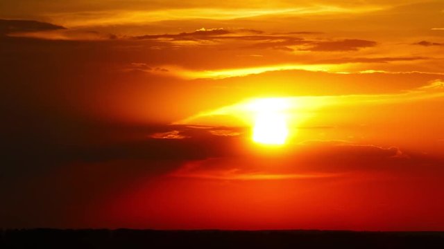timelapse with dramatic red sunrise on dark cloudy sky, 4k
