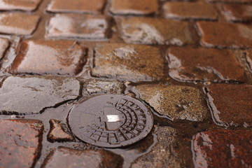 Old wet cobblestone in the rain