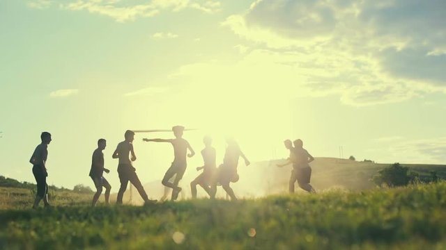 Young boy trying to score a goal in a sunny day