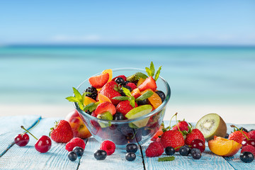 Fresh juice with fruit mix on the beach