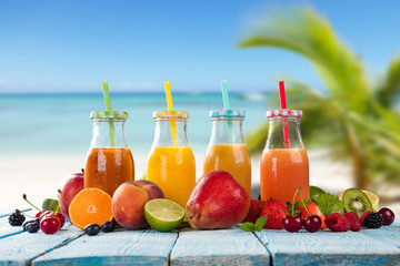 Fresh juice with fruit mix on the beach