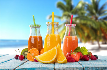 Fresh juice with fruit mix on the beach