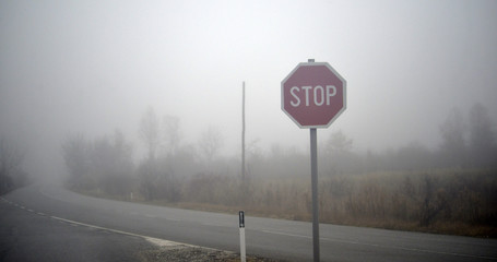 Road and a car in fog