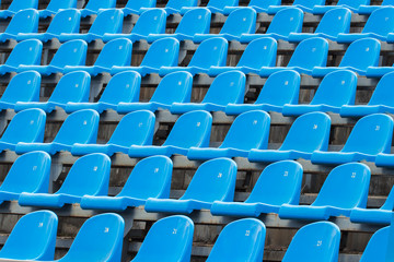 Fototapeta premium Background of empty blue seats in a stadium