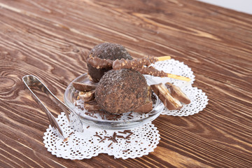 Cupcake with chocolate on wooden background