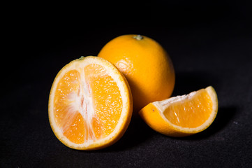 Oranges isolated on black background