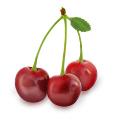 three juicy cherries with green leaf on a white background