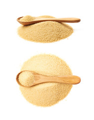 Spoon over pile of sugar