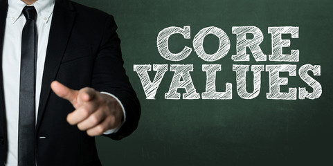 Business man pointing with the text: Core Values