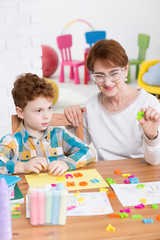 Fototapeta premium Helping him understand what letters are all about