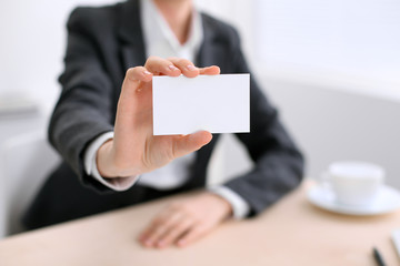 Business woman giving visit card