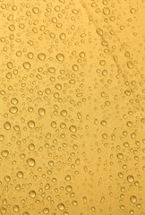 Rain water drop on gold background