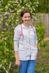 Young professional/Portrait of the young veterinarian on one of the farms of the area