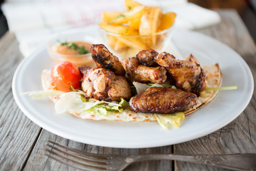 Fried chicken with potatoes
