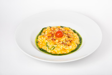 Yellow risotto in a white plate