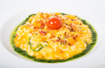 Yellow risotto in a white plate