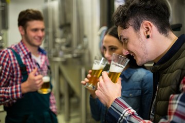 Brewers testing beer at brewery factory