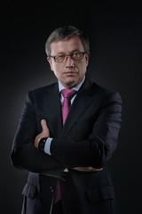 businessman in a suit on a dark background