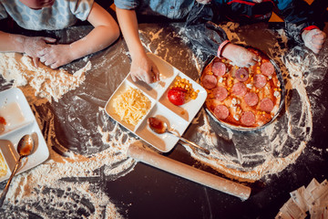 Children make pizza at home