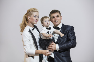 Family, dad, mom and daughter stylish and fashionably dressed be