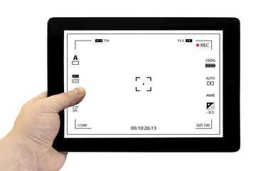 Tablet photography concept. Taking pictures on a tablet. Empty tablet PC in hand isolated on white....