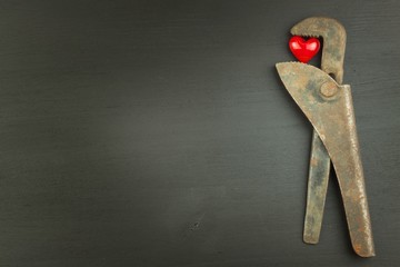 Stress and health. Heart under stress. Rusty vice crushed red heart. Working under stress.