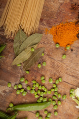 Vegetables and pasta on wood background. Bio Healthy food, herbs and spices. Organic vegetables