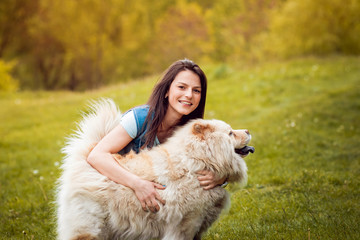 Young woman with the dogs in the park.