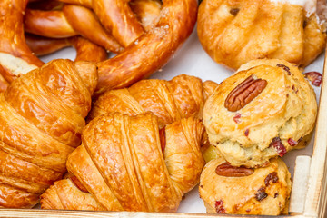 Bakery Bread on a Wooden Table. Various Bread and Sheaf of Wheat