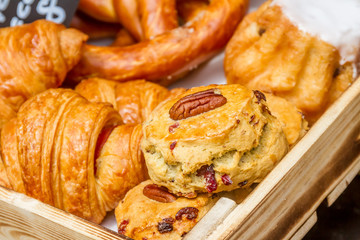 Bakery Bread on a Wooden Table. Various Bread and Sheaf of Wheat