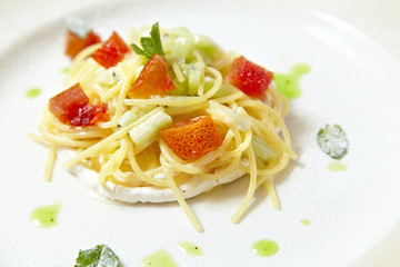 Sweat pasta nests with fruits isolated on white